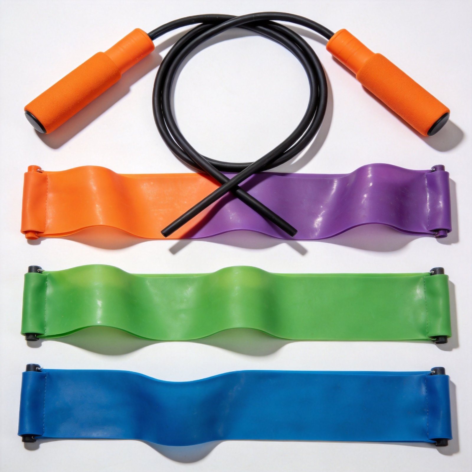 Colorful resistance bands and jump rope workout equipment